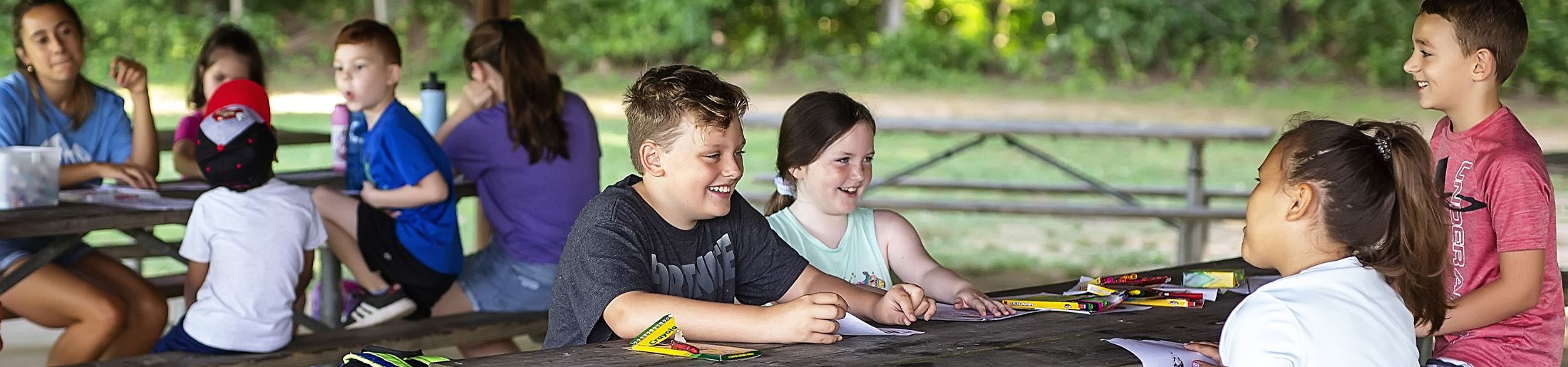 Kids at picnic tables