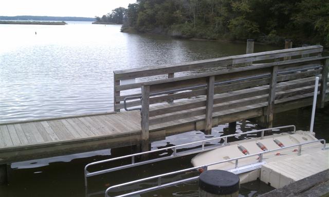 Wooden dock leading to boat ramp